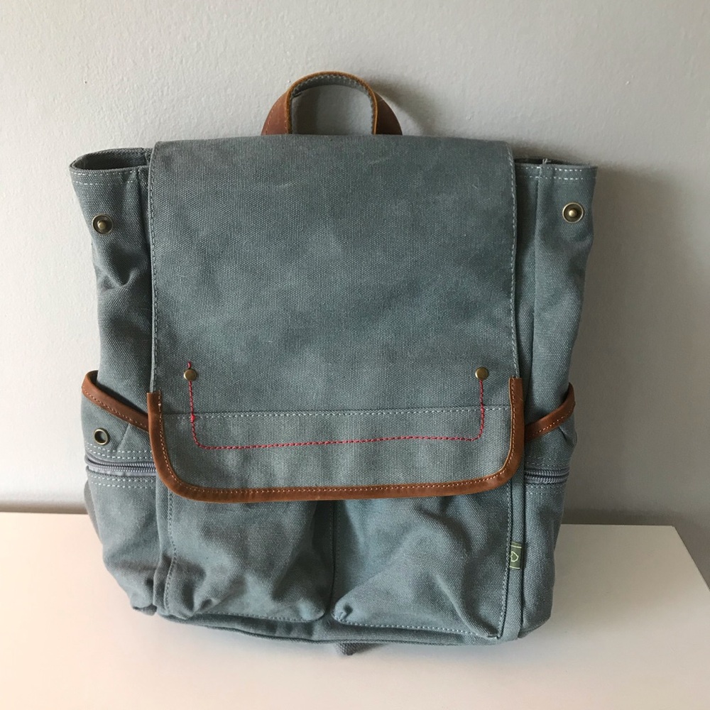 Stylish Teal Canvas Backpack with Brown Leather Trim.